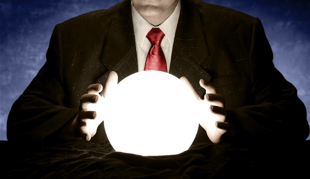 Businessman Consulting Glowing Crystal Ball — illustrating Borgrum Consulting